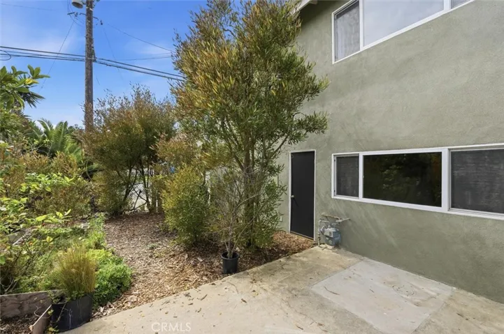 Back yard and back door to garage
