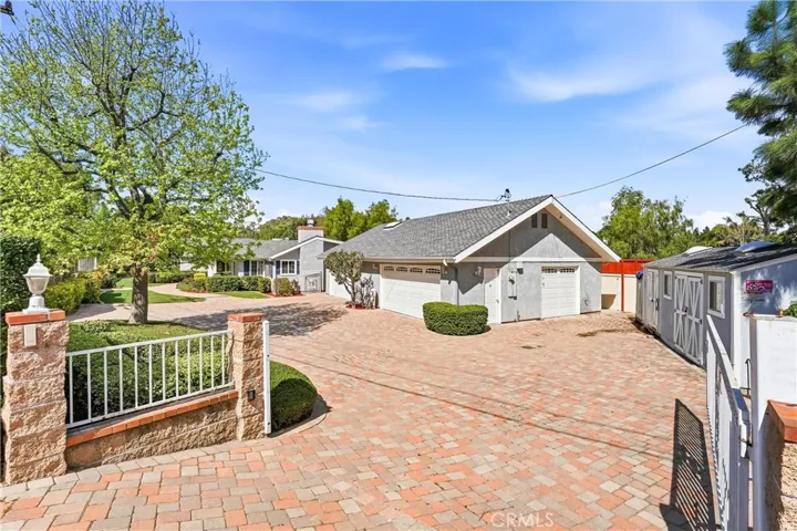 Gated entrance to house and 4 car garage.