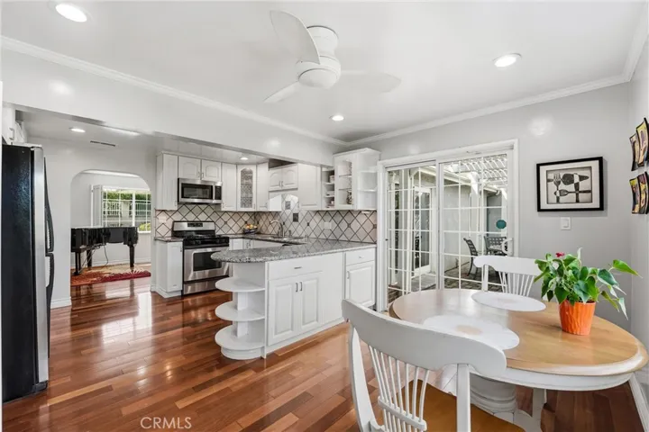 Spacious Kitchen with breakfast nook and direct access backyard.