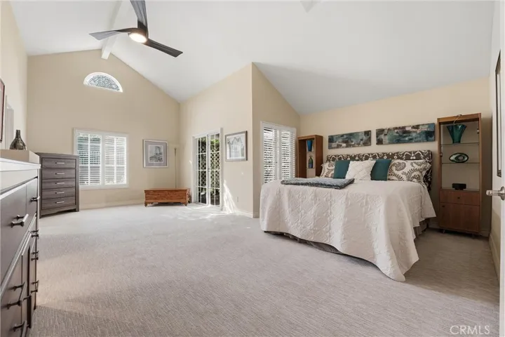Large Primary Suite with fireplace, walk in closet, retreat, and direct access to a private patio.