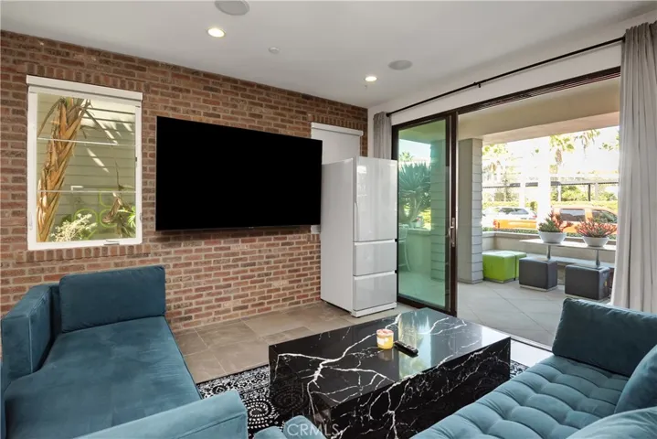 Media room opens to the patio and barbecue grill.