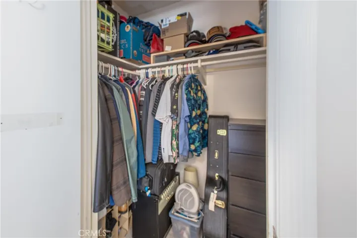 This is the first of two walk-in closets in the primary bedroom.