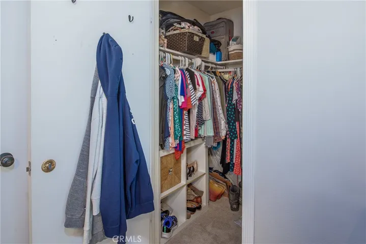 This is the second walk-in closet in the primary bedroom.