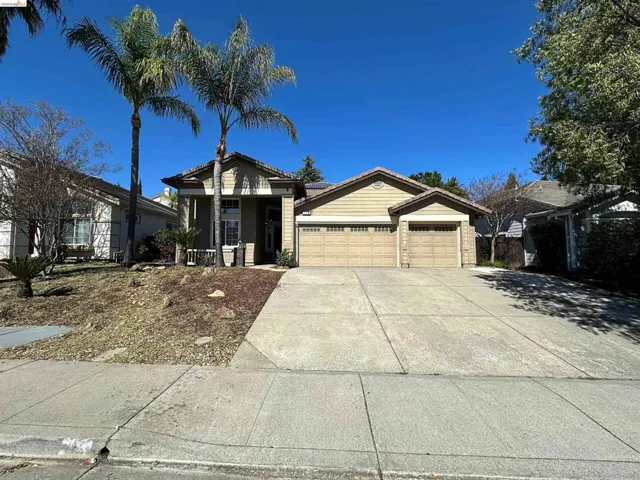 View of front of house featuring a garage and driveway