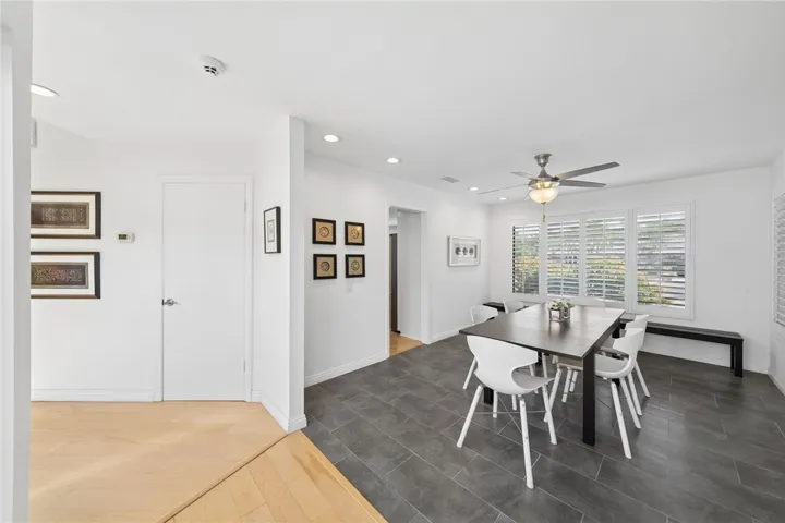 Bright dining space features large windows, contemporary tile flooring, and an easy connection to the adjoining living areas for seamless gatherings.