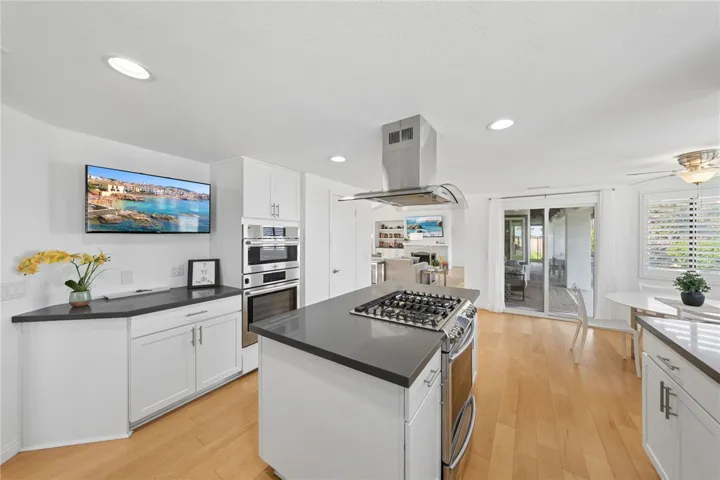 Spacious kitchen with a large island, sleek vent hood, built-in ovens, and an open connection to the surrounding living areas. Ideal for casual meals, meal prep, and easy​​‌​​​​‌​​‌‌​​‌​​​‌‌​​​‌​​‌‌​​‌‌​​‌‌​​​​ entertaining.