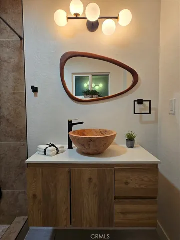 Tavertine sink bowl with floating cabinet