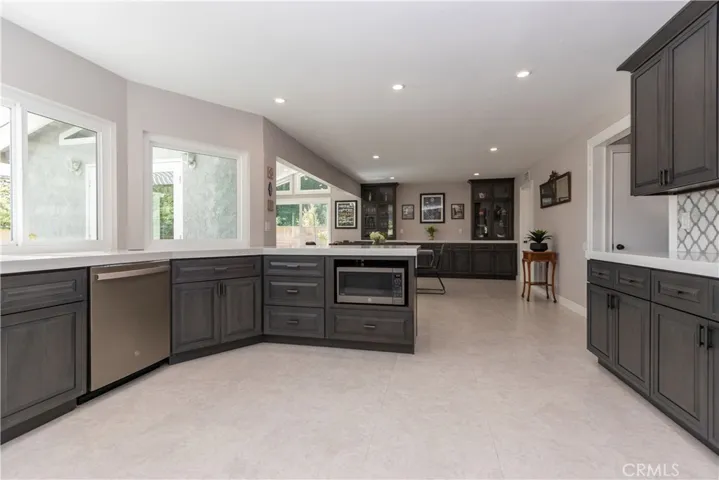 Loads of cabinets and counter space in the kitchen.