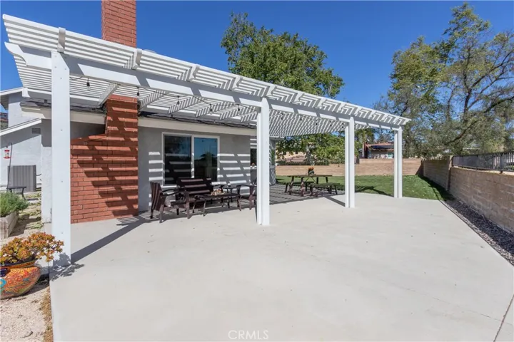Expansive covered patio in the backyard.