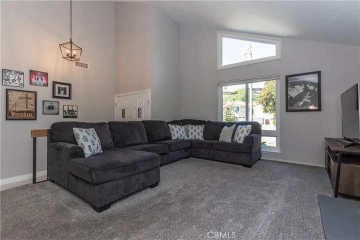 Plush gray carpet and crisp white walls.