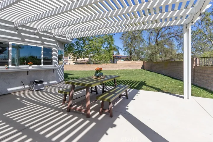 Huge backyard with covered patio and wonderful lawn.