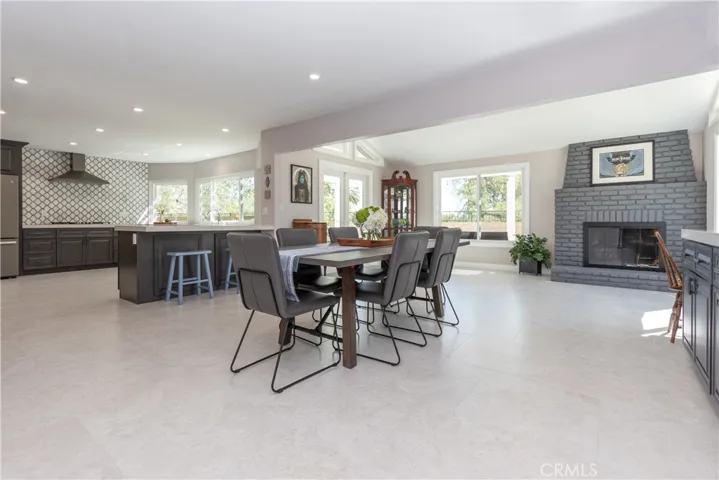 Tile floors and recessed lighting in this living space.