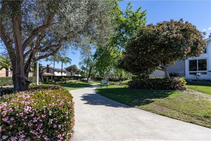 Walkway to the park just to the left of the home.