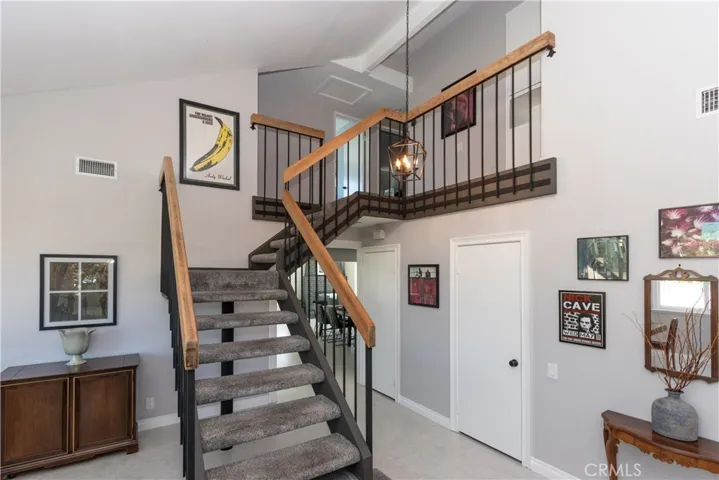 Open staircase to the bedrooms upstairs.
