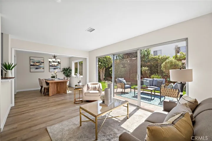 Open concept family room, dining combo with large sliders to private backyard