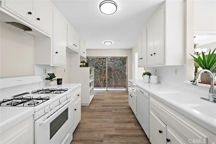 Refreshed kitchen with a new dishwasher, garbage disposal
