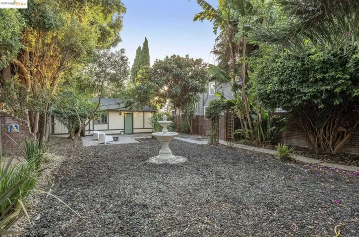 Fenced backyard with a patio area