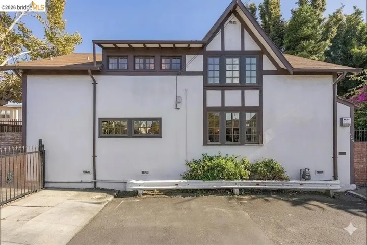 Rear view of house with stucco siding