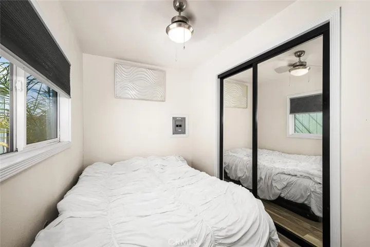 Main bedroom includes large closet with mirrored doors