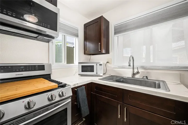 Granite countertops & stainless steel farmhouse sink