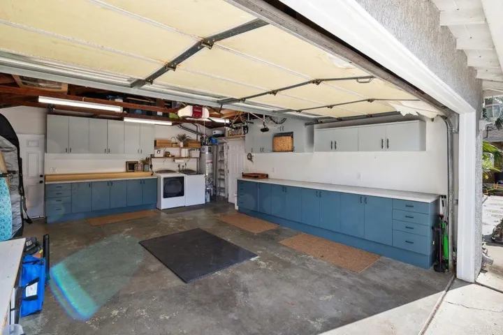 Big 2 car garage with tons of cabinet and counter space