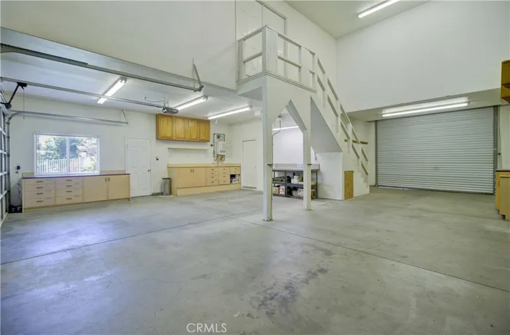 More car barn parking and workshop area.  Also second studio access.