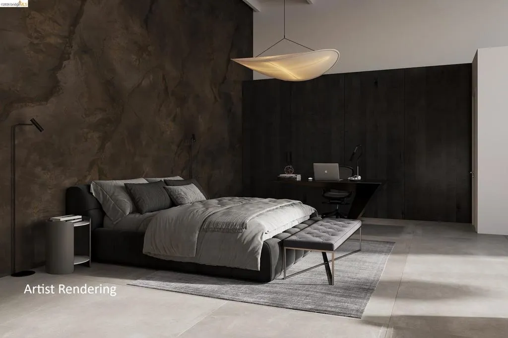 Bedroom with concrete flooring and a desk