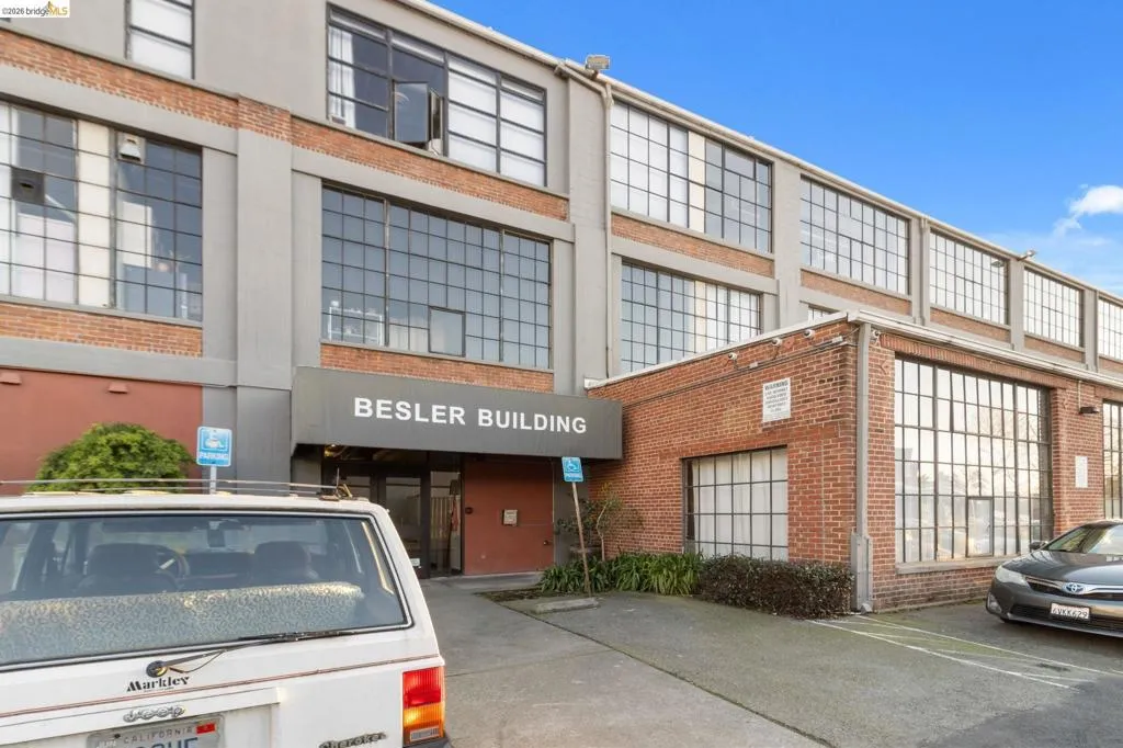 View of property featuring uncovered parking