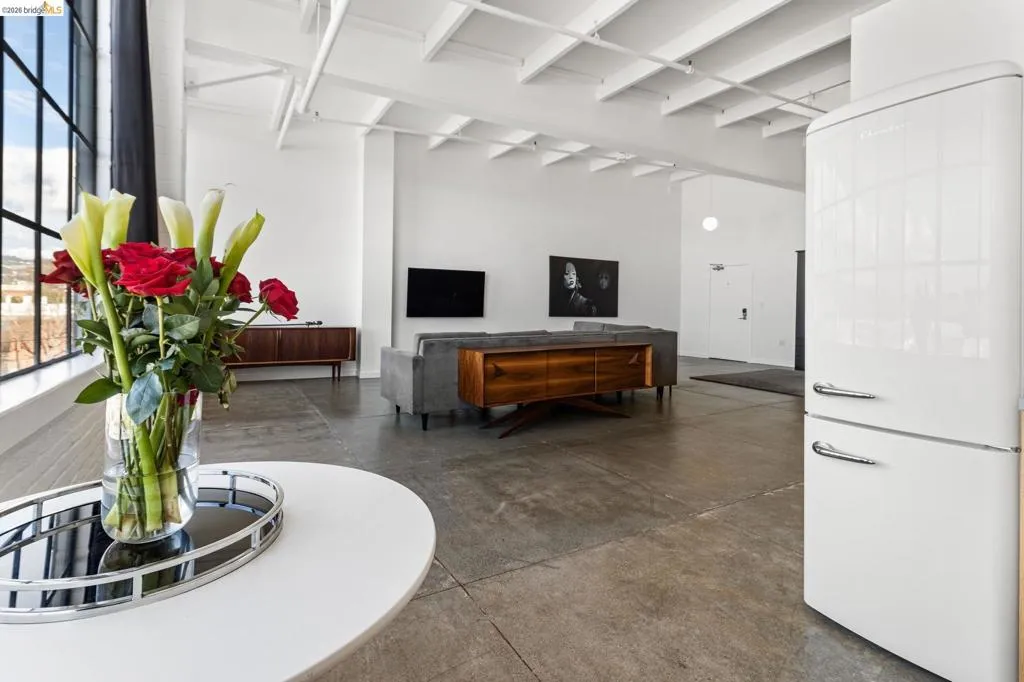 Common area featuring beam ceiling
