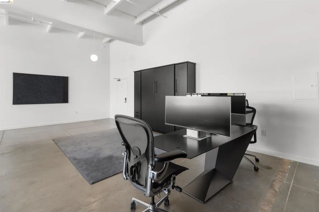 Office area featuring a high ceiling