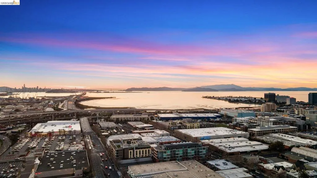 Aerial view at dusk of a water and mountain view and a city view