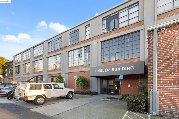 View of property featuring uncovered parking
