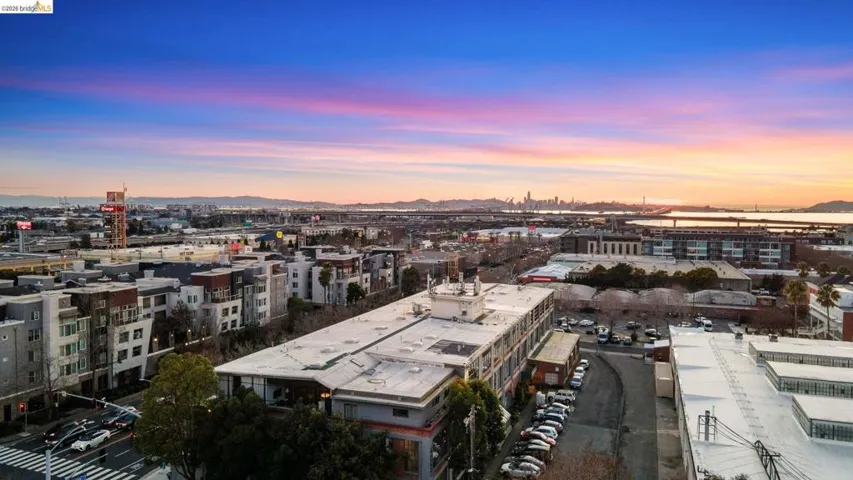 Aerial view at dusk of a mountain view and a view of city