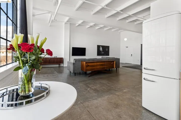 Common area featuring beam ceiling