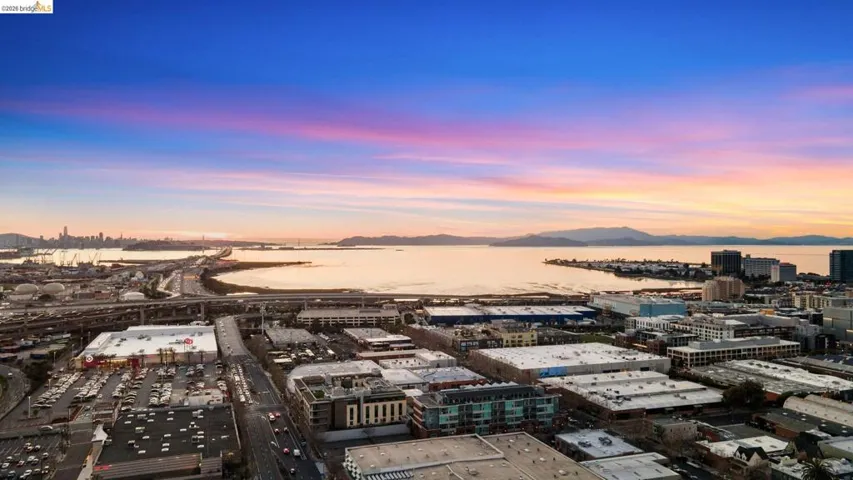 Aerial view at dusk of a water and mountain view and a city view