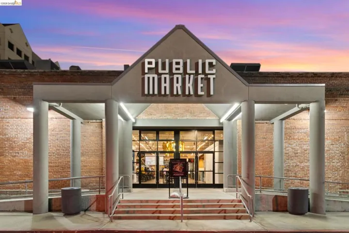 Property entrance featuring brick siding
