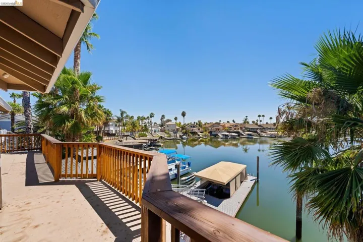 Dock with a water view and a residential view