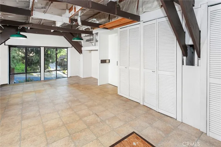 POTENTIAL GUEST QUARTERS OPPORTUNITY highlights this elevated West Hills hillside mid-century modern home designed by architect David Freedman, known for his mid-century designs for several local builders. A rare two-story garage addition rises to the roofline of the main home and offers access from both the lower level and the main house level, creating the POTENTIAL FOR A GUEST QUARTERS or CREATIVE STUDIO. The upper level is bright and open with multiple windows and oversized picture windows that captu...