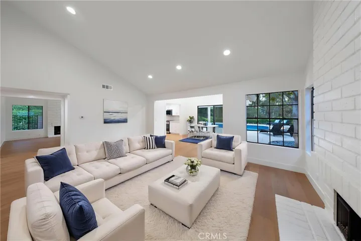 Virtually staged living room and dining room.