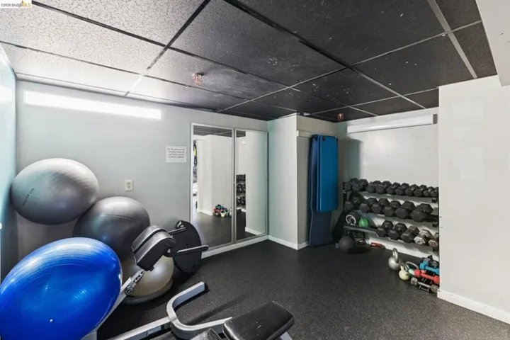 Exercise area featuring a drop ceiling