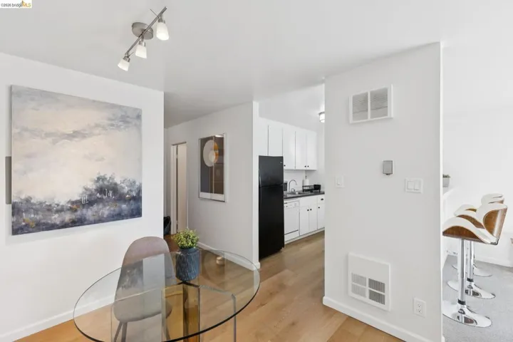 Dining area featuring light wood-style floors and baseboards