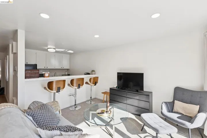 Living room featuring recessed lighting and light colored carpet