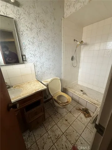 Junior Primary Bathroom with vanity and shower