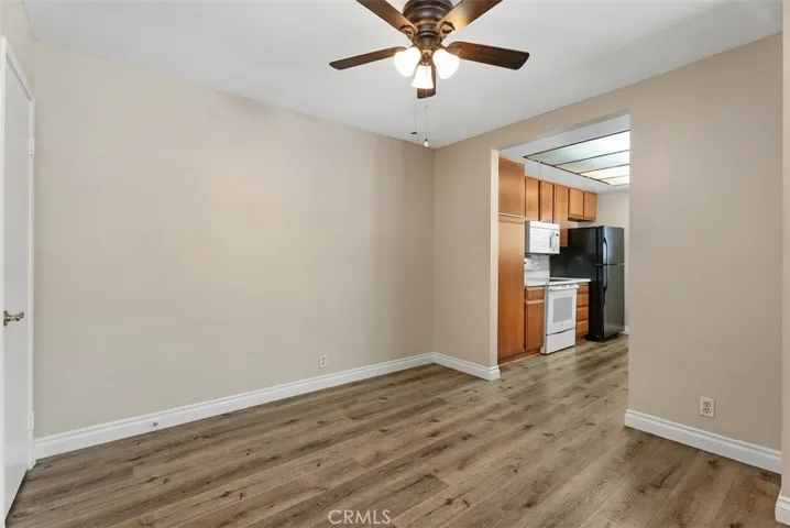 Dining Area and Kitchen – Dining area opens directly to the kitchen for easy serving and a connected feel. Clean lines and durable flooring carry throughout for a cohesive look.
