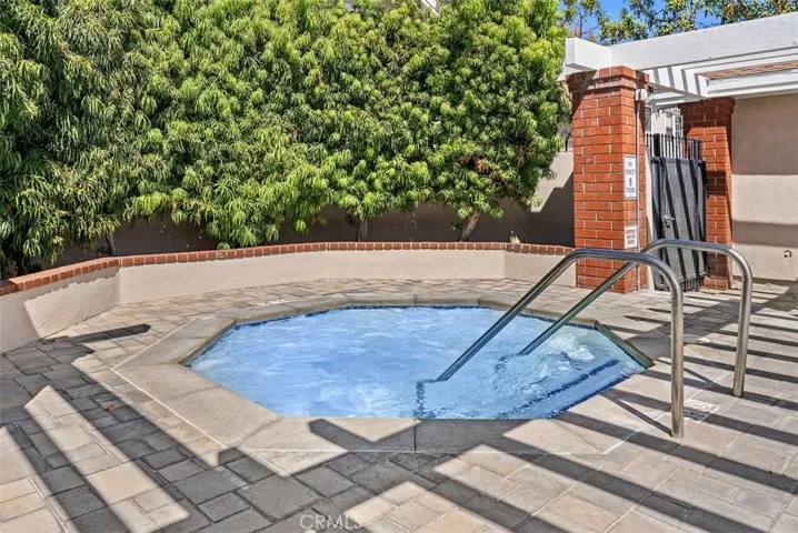Community Spa – Community spa offers a peaceful setting with step-in access and surrounding greenery for added privacy. A welcoming space to unwind close to home.
