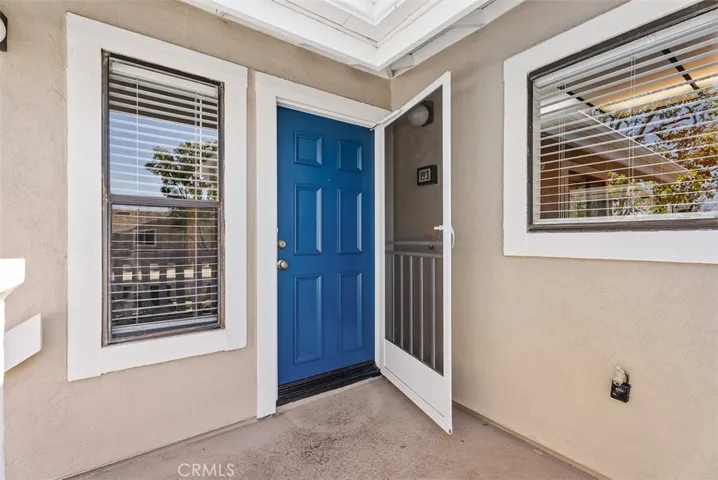 Front Entry – 2nd level front entry with a bold blue door and screened door for added function and curb appeal. A welcoming exterior detail that creates a polished first impression.