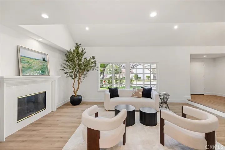 Relax by the cozy fireplace with a good book.