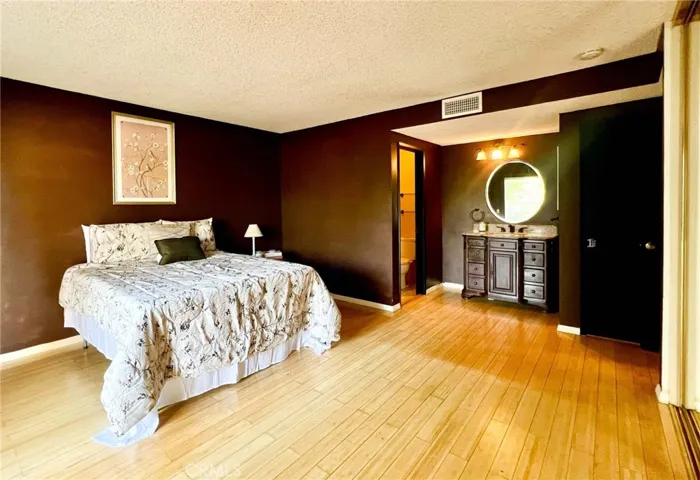 Primary bedroom with vanity area