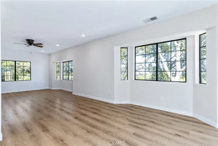 Original photo of dining area and living room.