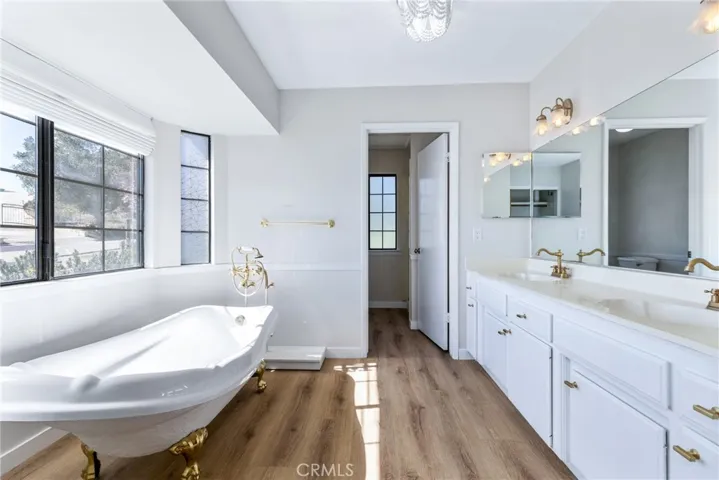 Sizeable ensuite bathroom has elegant finishes and charming features.